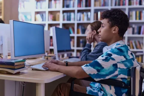 teenage-boy-using-computer-in-school-2026-03-23-23-02-08-utc 1.png